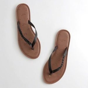 Hollister Braided Faux Leather Flip Flops in Black